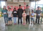 Penyerahan program pendidikan Desa Pasar Melayu