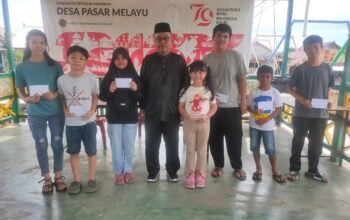 Penyerahan program pendidikan Desa Pasar Melayu
